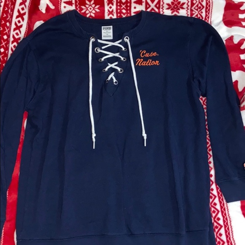 Pink sweatshirt “‘cuse nation”